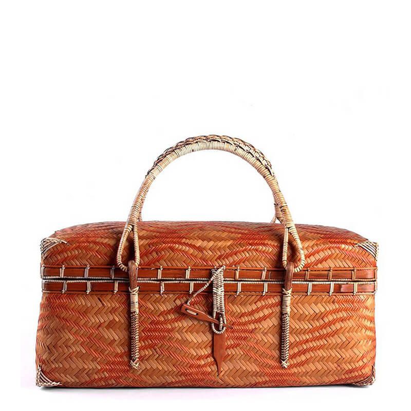 Natural bamboo woven basket bag with leather rope tie closure front detail