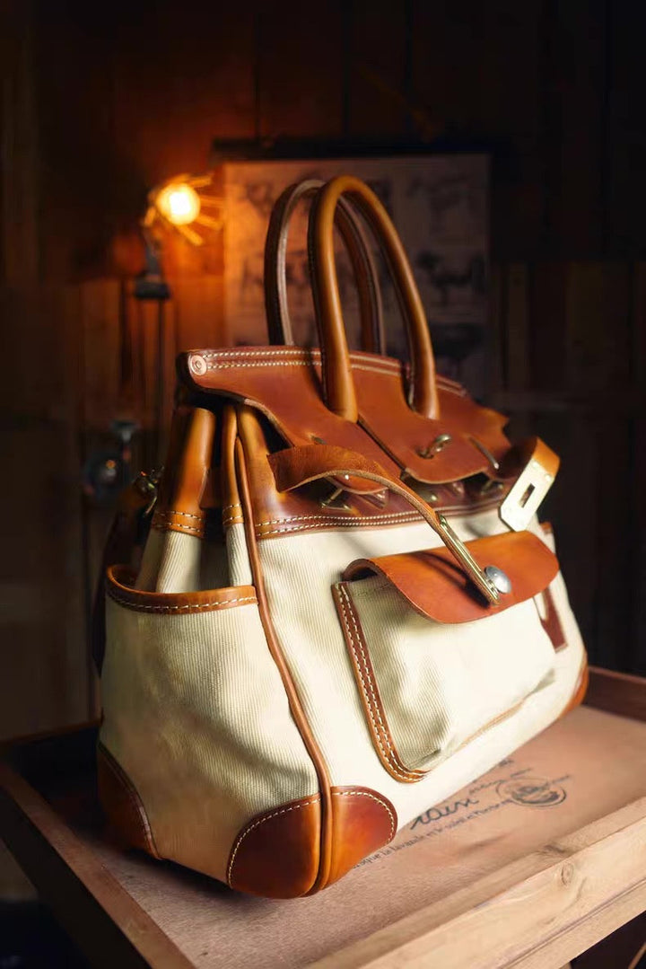 Leather handbag with brown accents on a wooden surface