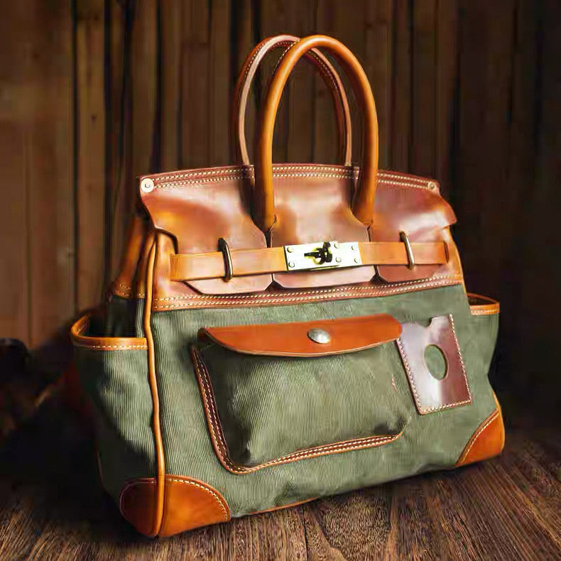 Vintage style canvas travel bag with brown leather trim