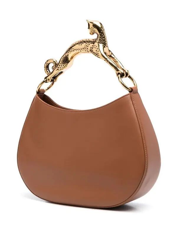 Brown handbag with a gold handle on a white background