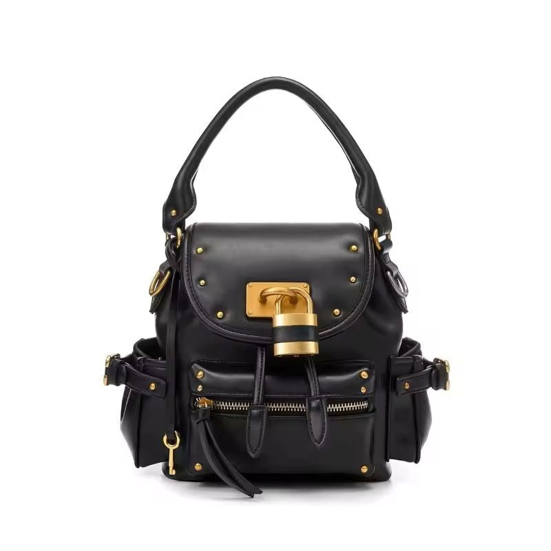 Soft leather structured bag side view showing buckle strap detail and D-ring hardware
