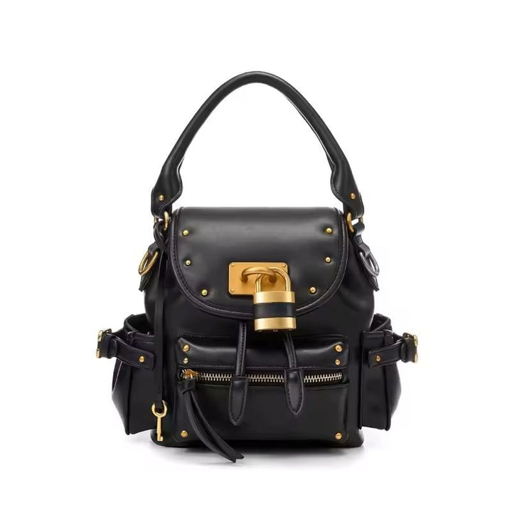 Soft leather structured bag side view showing buckle strap detail and D-ring hardware
