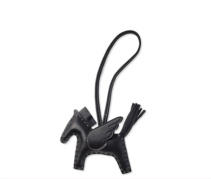 Black leather keychain with a horse design on a white background