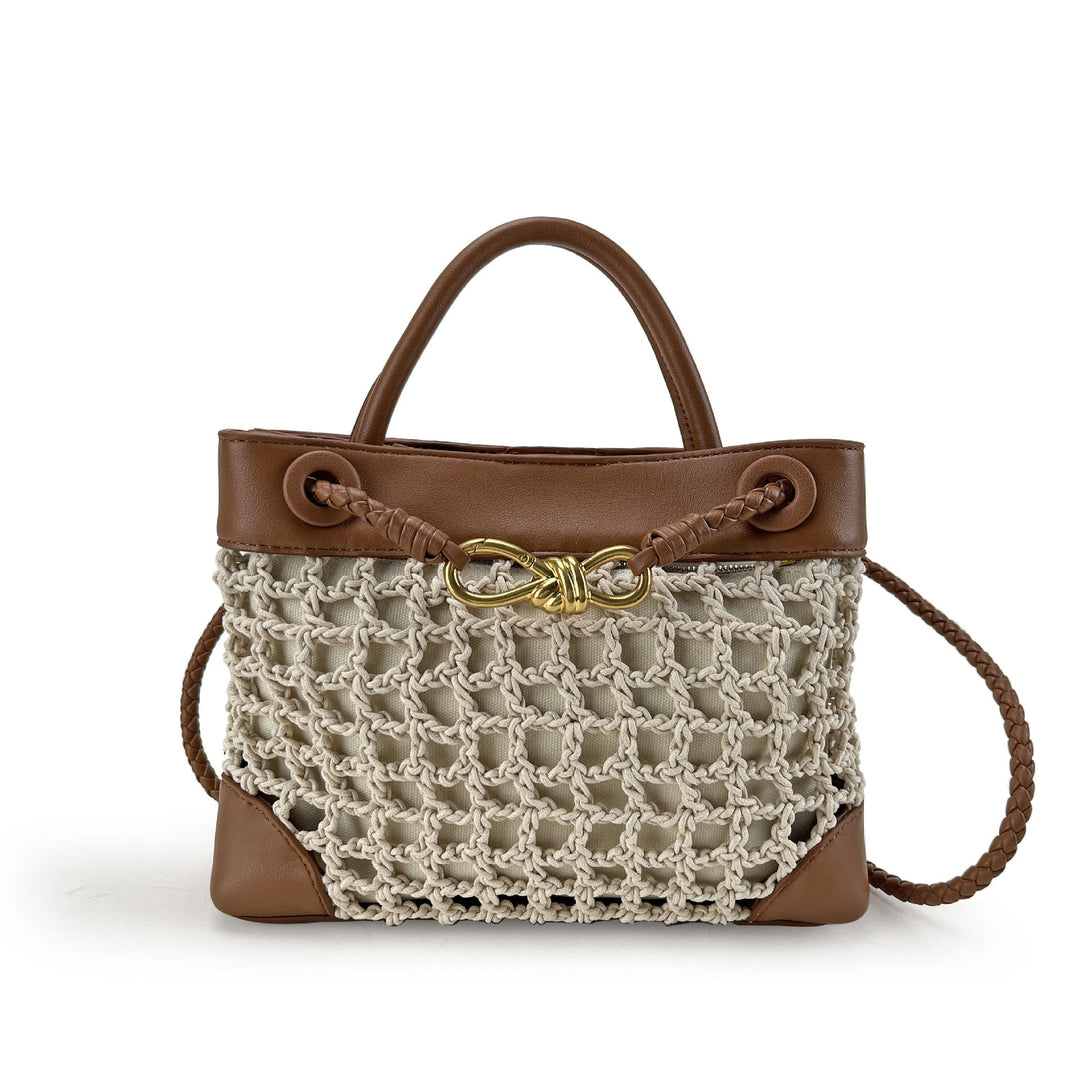 Brown handbag with a textured beige netted front section on a white background