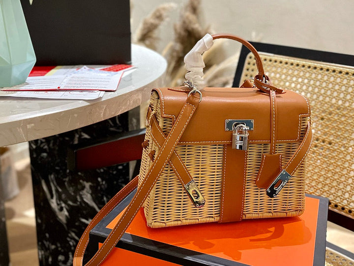 Brown and beige handbag on a table with a blurred background