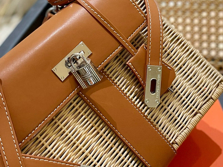 Brown leather handbag with gold lock on a woven surface