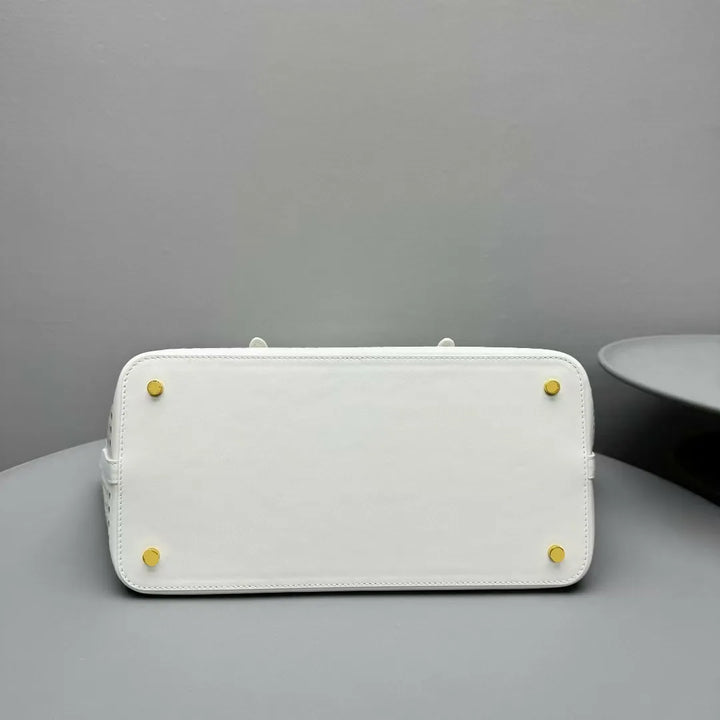 White rectangular object with yellow accents on a gray surface