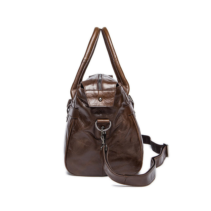 Vintage style brown leather holdall with belt