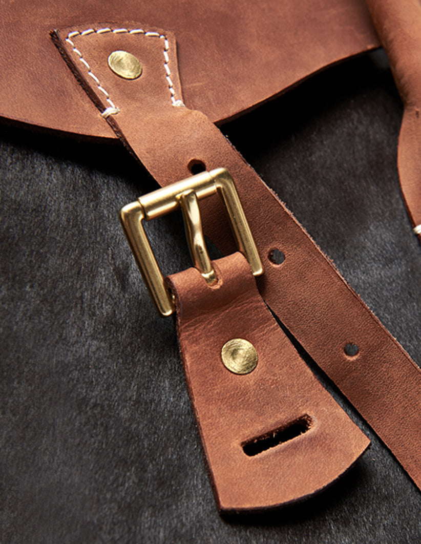 Cowhide leather bag with gold stud hardware