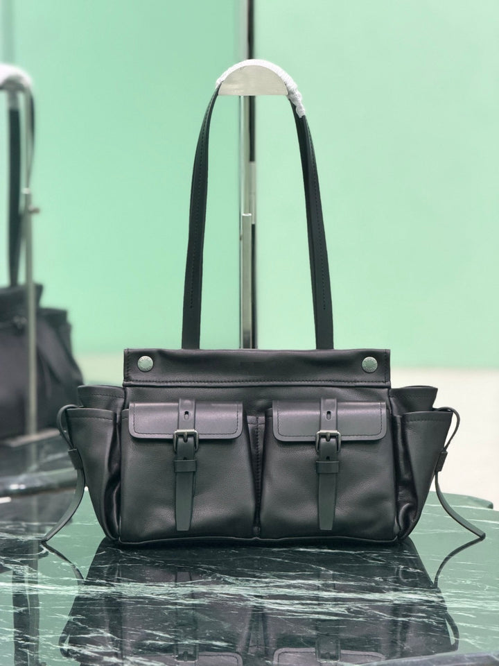 Structured black leather bag with side pockets