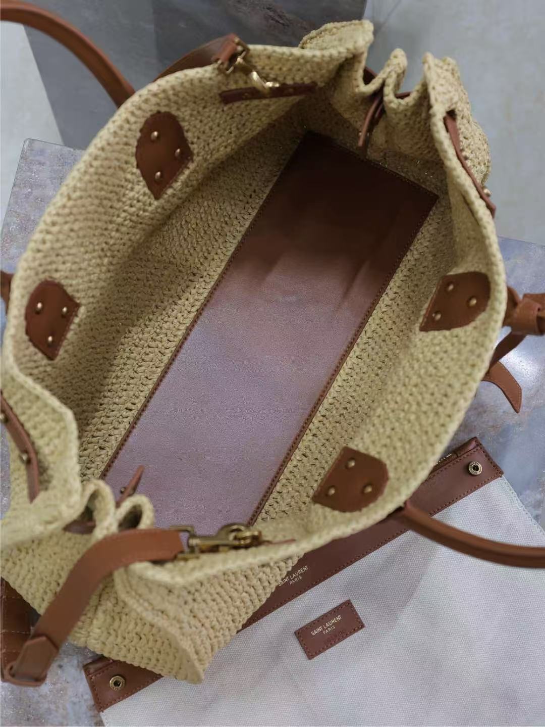 Natural raffia weekender with tan leather studs