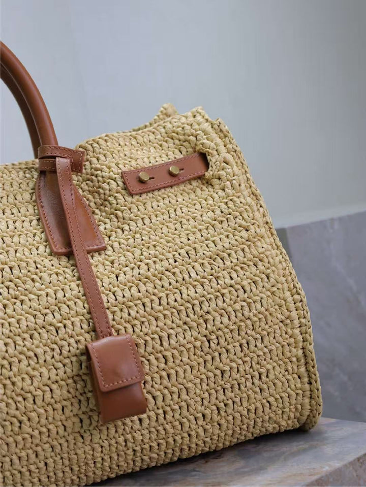 Handcrafted raffia bag with leather handle tabs