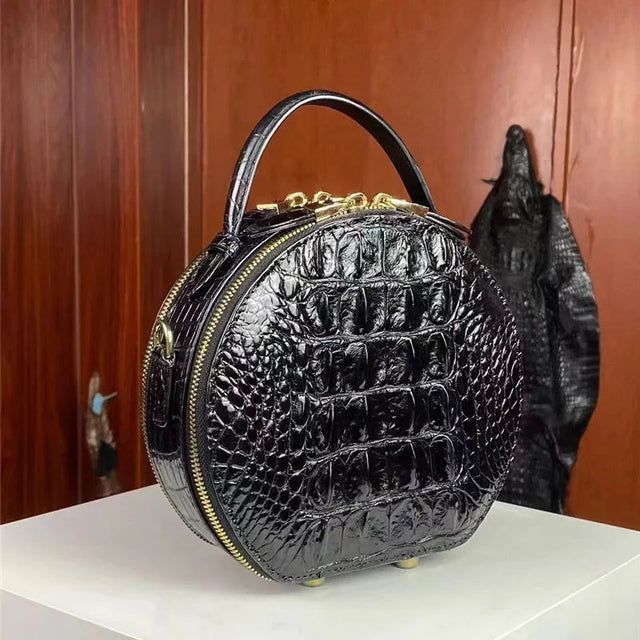 Luxury women round croc bag with smooth polished surface and gold hardware