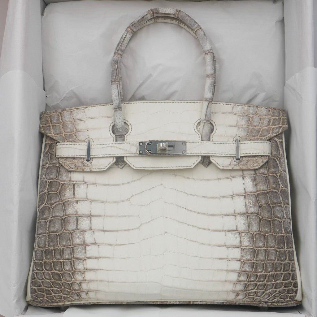White handbag with brown crocodile leather trim in a box