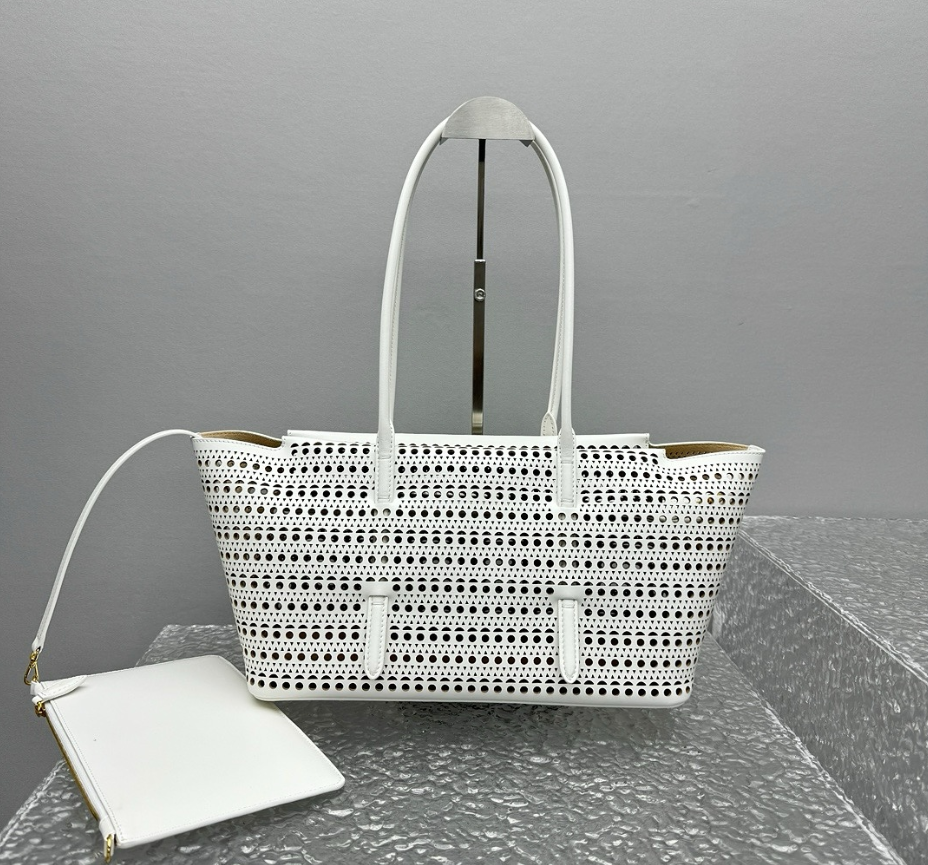 Black laser cut perforated leather tote bag