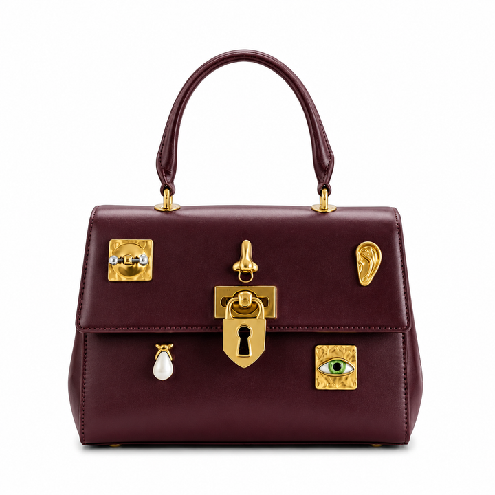 The Sculpted Hardware Top Handle Bag