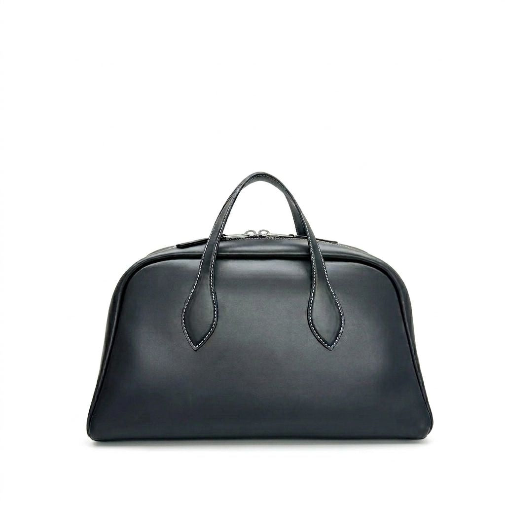 Black leather handbag on a white background