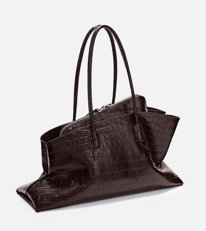 Asymmetric leather handbag with crocodile texture and long tubular top handles