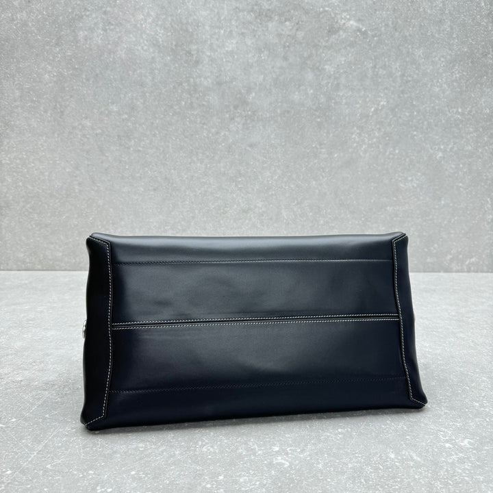 Minimalist black leather top handle carryall bag