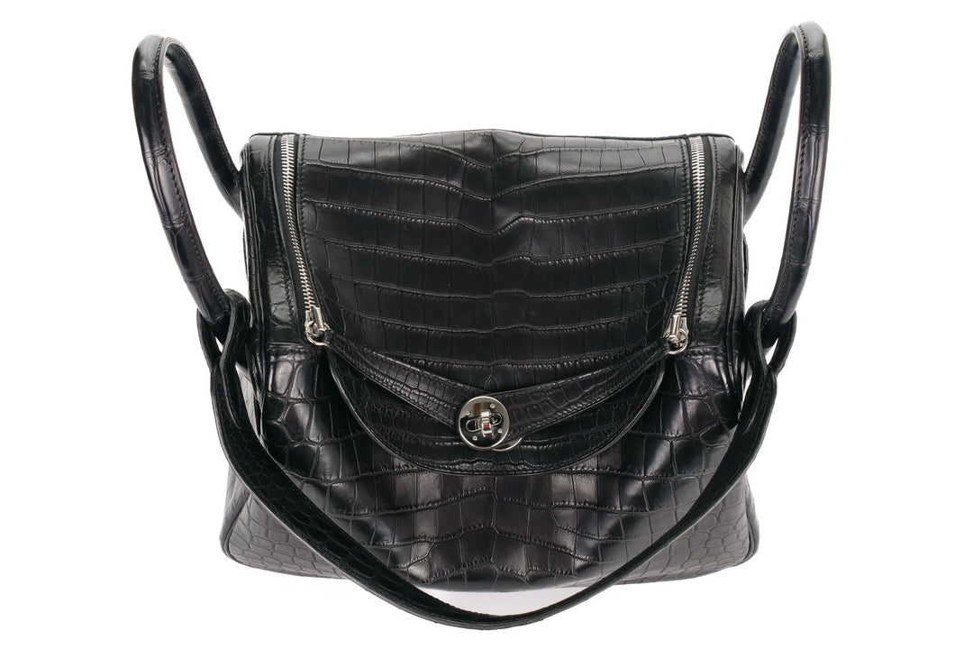 Matte Niloticus crocodile black bag with dual top handles and curved silhouette
