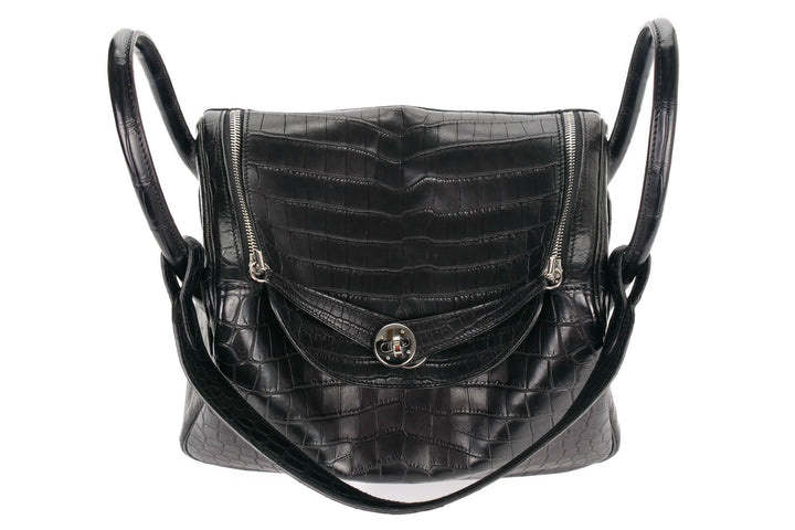 Matte Niloticus crocodile black bag with dual top handles and curved silhouette