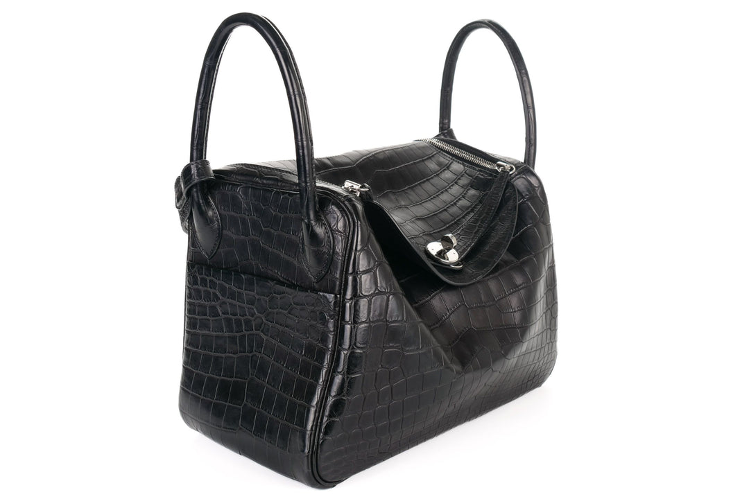 Black crocodile Lindy bag side view showing structured body and base corners