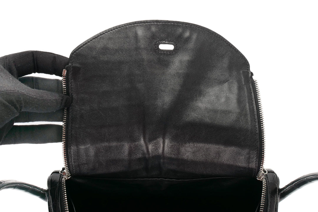 Black luxury crocodile Lindy bag base view showing feet and corner detail