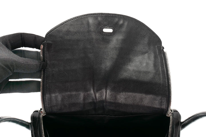 Black luxury crocodile Lindy bag base view showing feet and corner detail