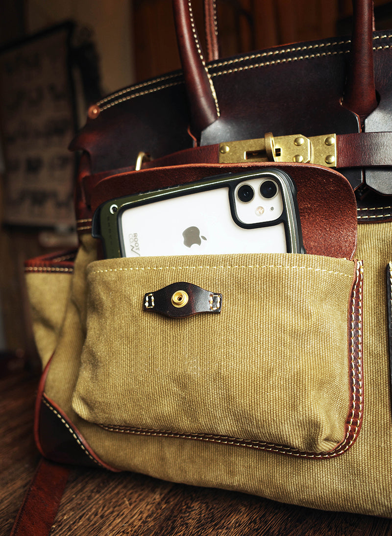 Premium canvas leather bag front pocket detail