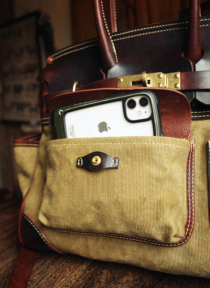 Premium canvas leather bag front pocket detail
