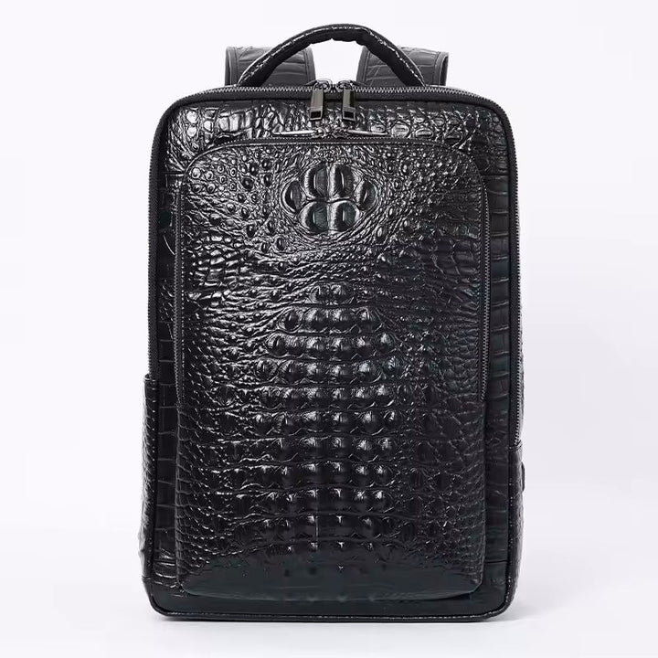Namrico black genuine leather backpack close-up of 3D crocodile head emboss on front panel
