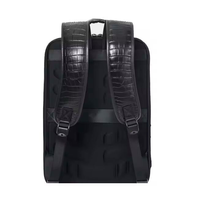 Black alligator-pattern leather backpack lifestyle shot on clean studio surface
