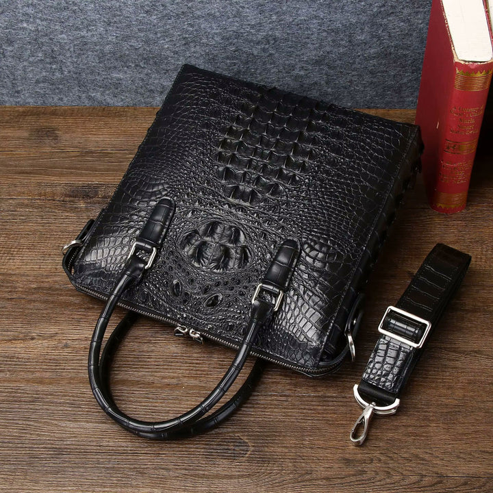 Namrico black genuine leather business bag close-up of croc head detail and silver hardware
