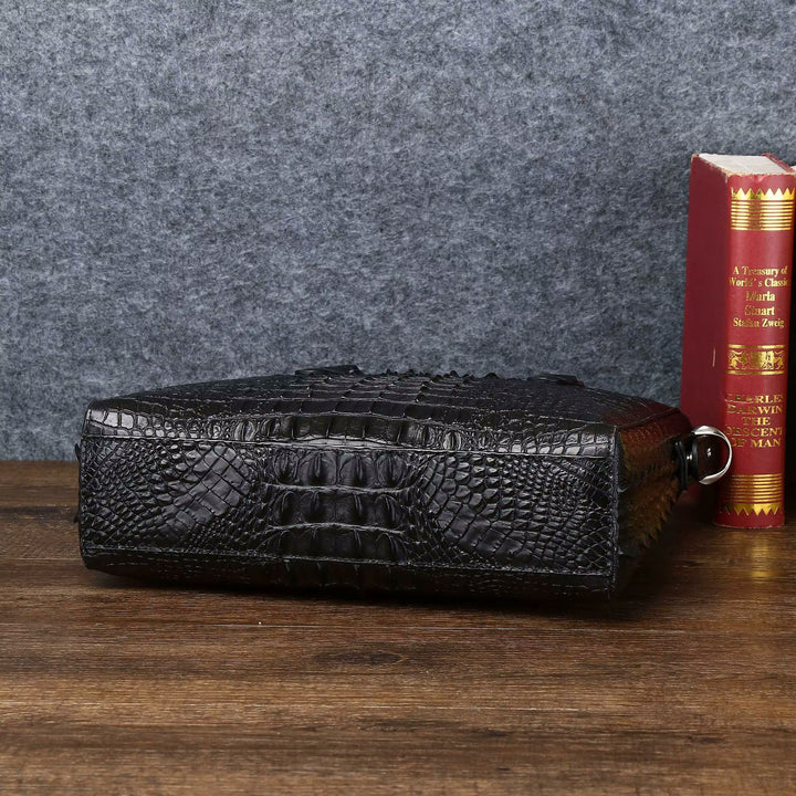 Croc-embossed leather top handle bag angle view highlighting deep scale texture and tall silhouette

