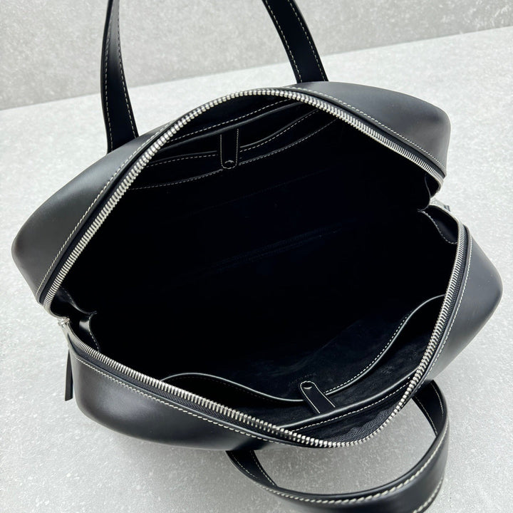 Smooth black leather carryall with white stitching