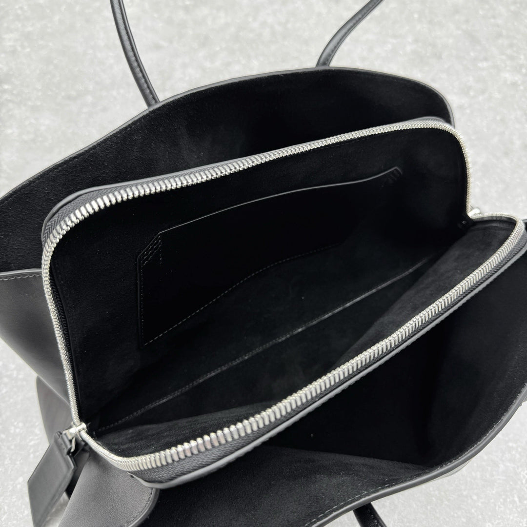 Large black leather tote with long thin straps