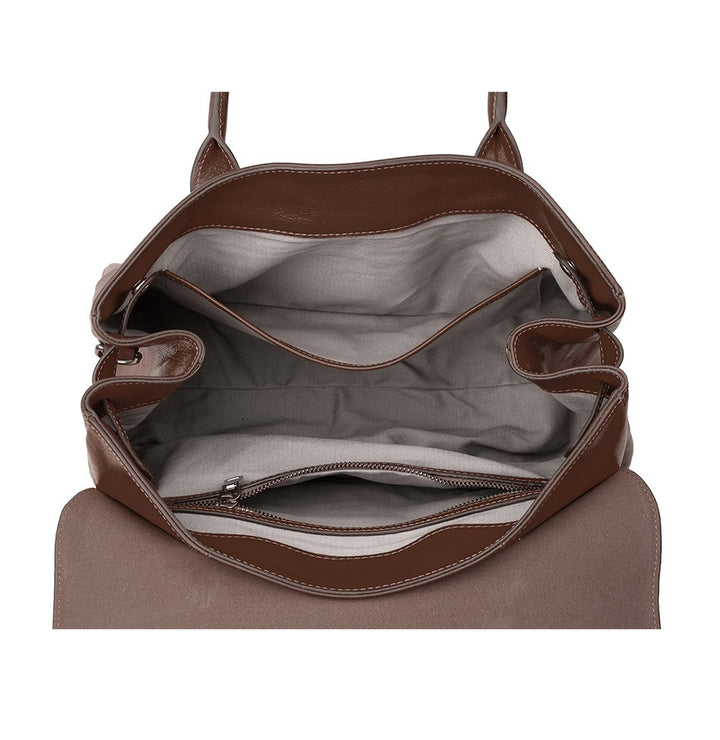 Brown leather bag with open front pocket on a white background