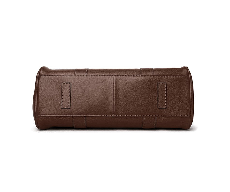 Brown leather toiletry bag on a white background