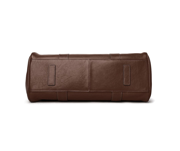 Brown leather toiletry bag on a white background