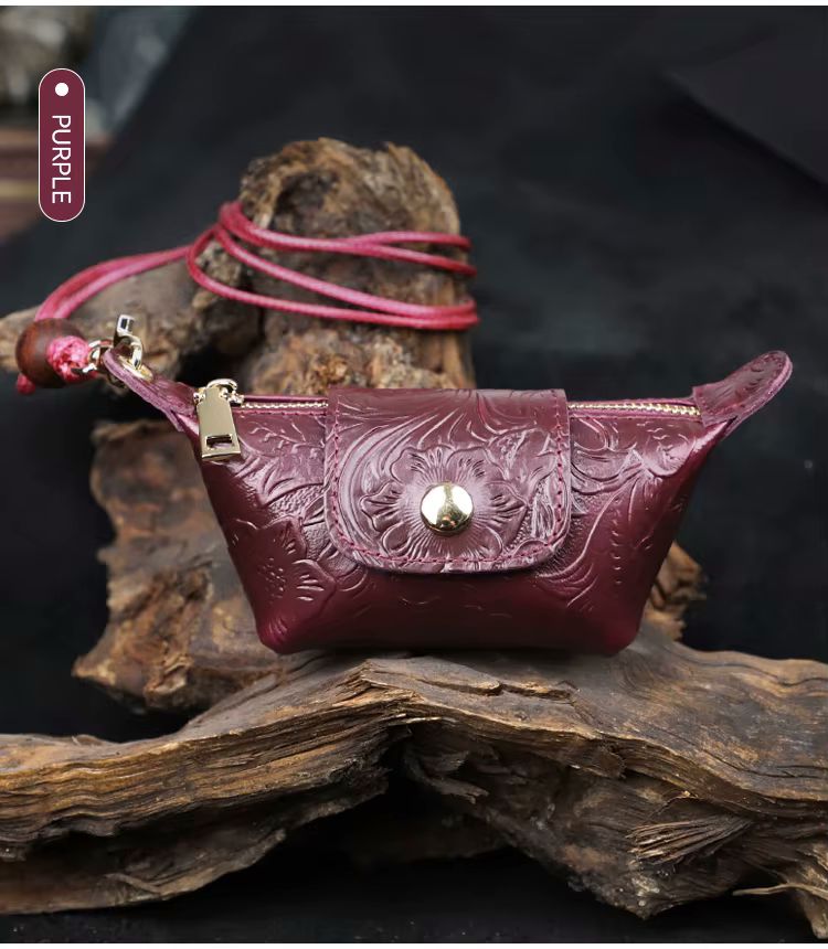 Brown genuine cow leather mini crossbody bag angle view showing compact silhouette and zip detail
