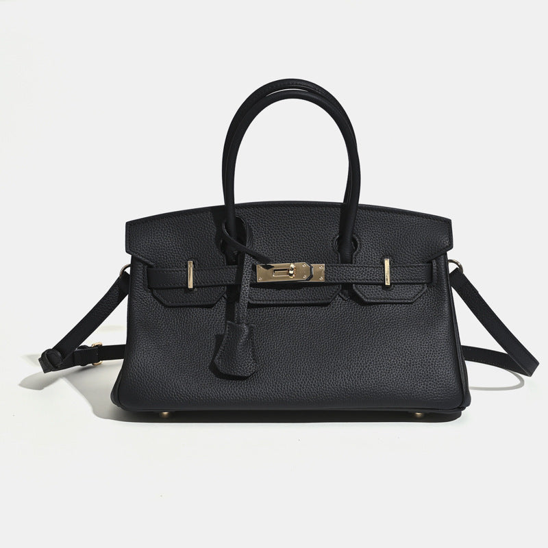 Luxury tan leather structured tote bag with contrast stitching and gold hardware detail