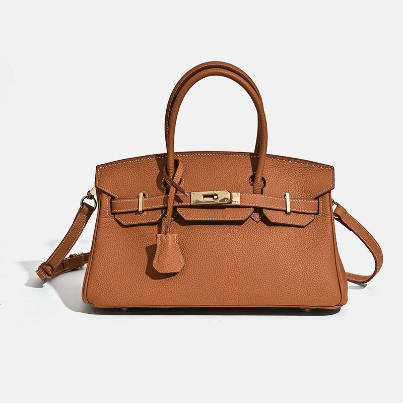 Full-grain leather top handle bag side view showing horizontal square structured shape