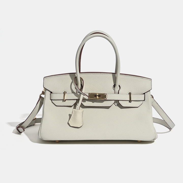 Brown leather luxury tote bag with adjustable crossbody strap and gold clasp hardware