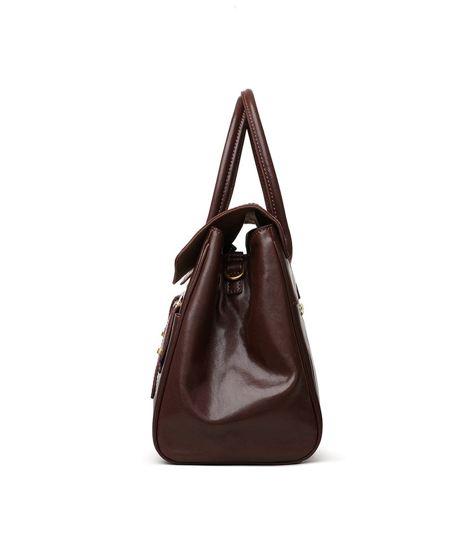 Brown leather handbag on a white background