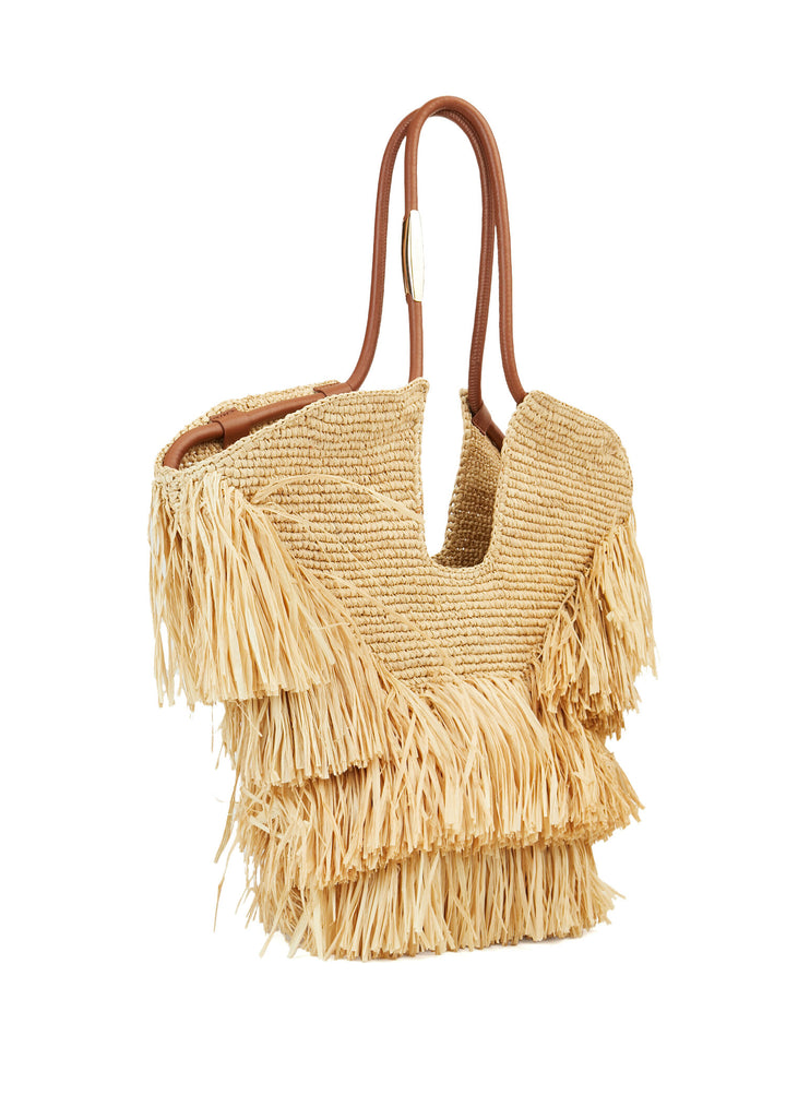 Woven handbag with fringe details on a white background