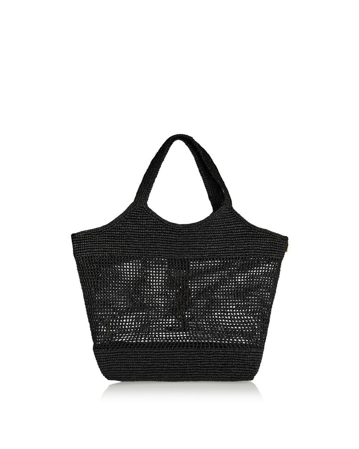 Luxury artisan woven raffia tote bag bronze hardware close up detail