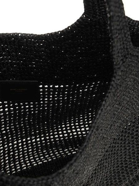 Namrico maxi raffia crochet tote bag in black lifestyle beach shot