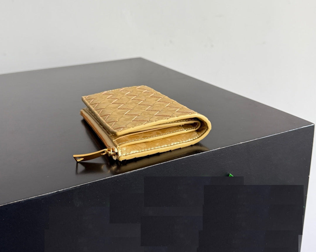 Compact gold leather wallet with zip closure