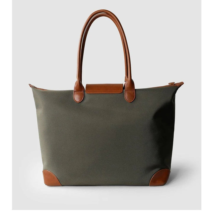 Waterproof travel tote with leather luggage tag