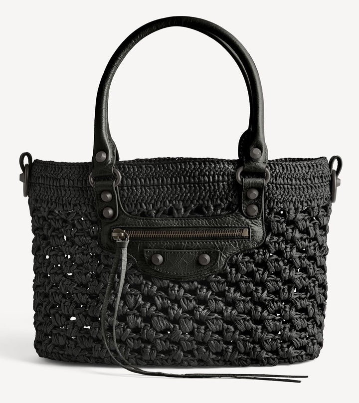 Full black raffia shoulder bag side view showing structured woven silhouette